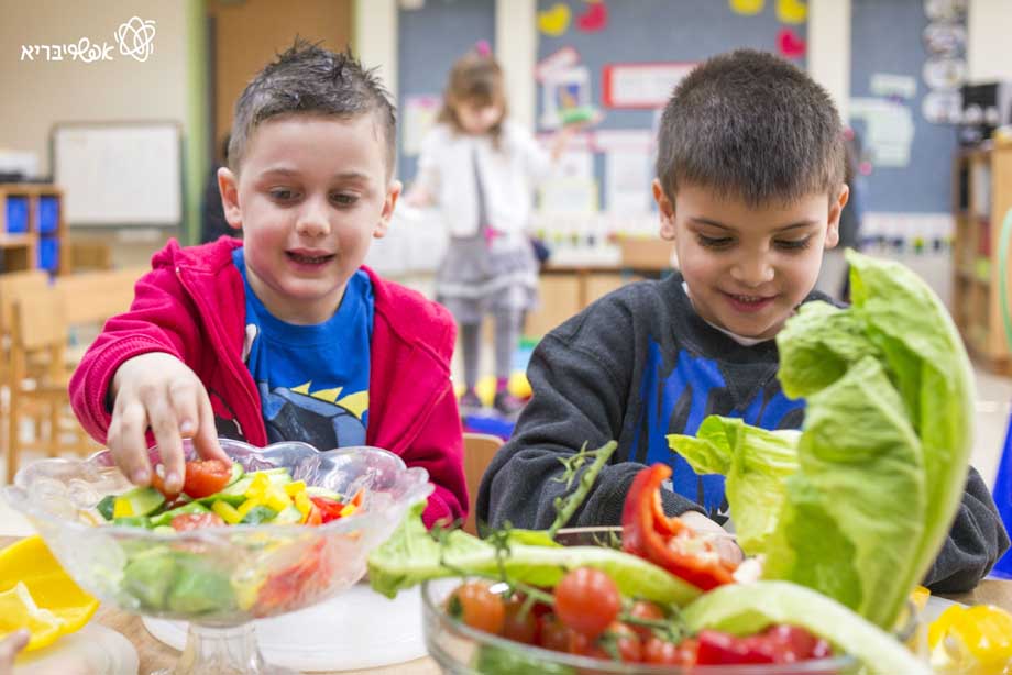Children eating salad