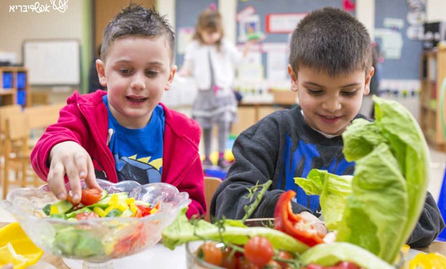 Children eating salad