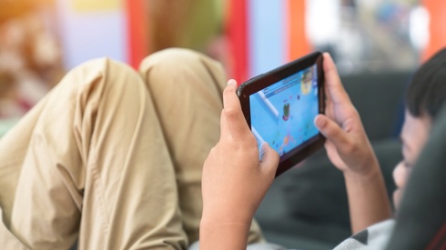 Child in front of screen