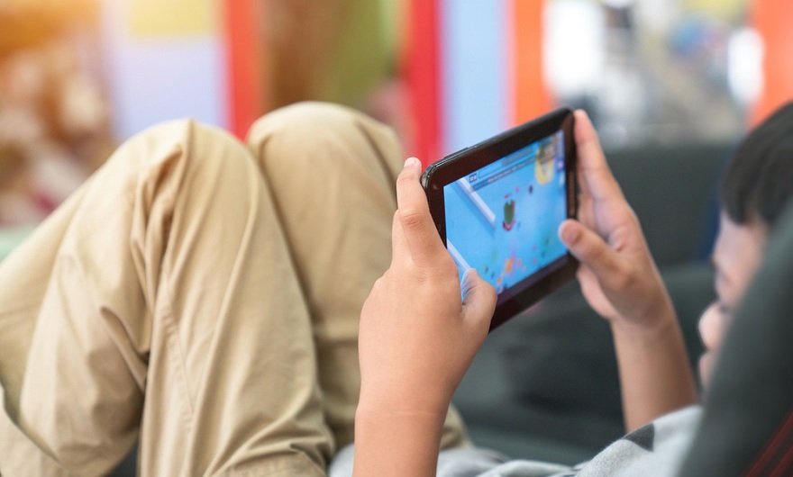 Child in front of screen